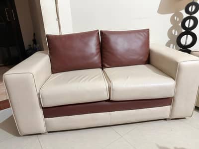 off-white and brown sofa set