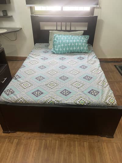 Queen bed with mattress and one side table