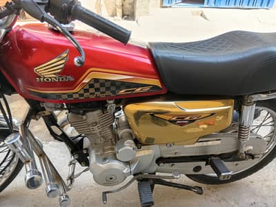 honda 125 red and golden new