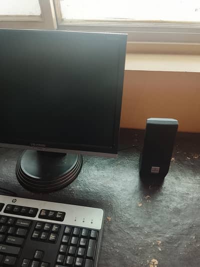 ViewSonic monitor, PC case, HP keyboard and audionic speakers