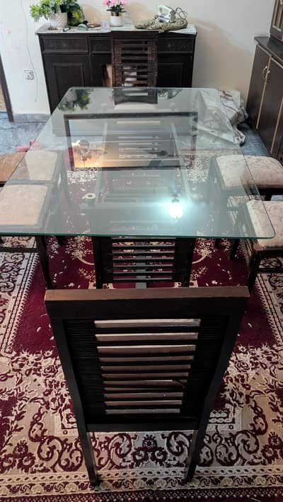 Glass Top dining table with wooden base and 6 chairs