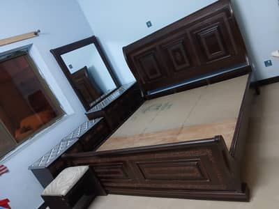 bed with dressing and side tables with stool.