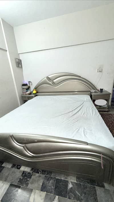 Bed with spring metres , side table and dressing table