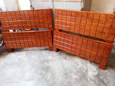 2 wooden single beds