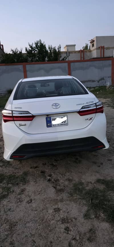 Toyota corolla Grande white colour with black interior