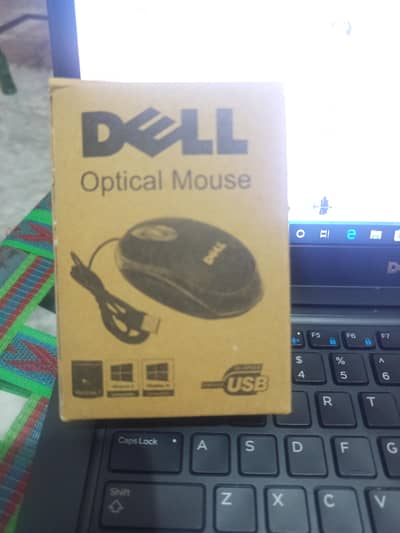 Dell mouse with box  open just  now