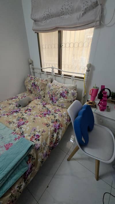 Heavy Iron bed with wooden bedside tables