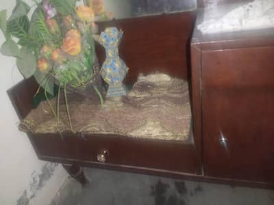 dresser with mirror and big box on side