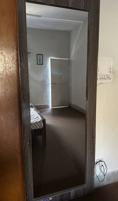 Wooden bordered wall mirror