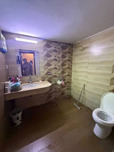 10 Marla very neat and clean Marble Floor Lower Portion is for rent in Tariq Gardens near Town Block E.