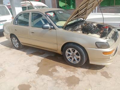 2001 moda Indus Corolla petrol CNG  per hy AC start hy