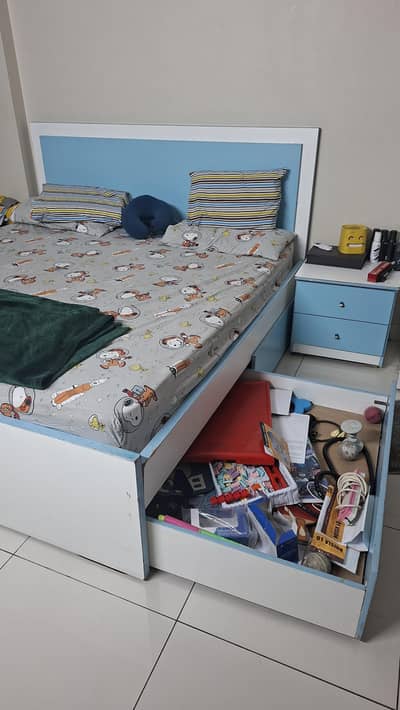 bed with extra luggage drawers