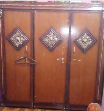 three door wood  wadrobe