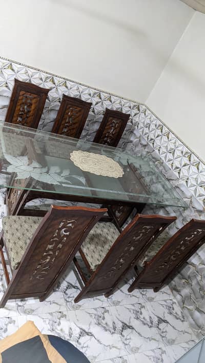 Dining Table with 6 Chairs available for sale.