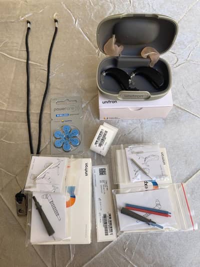 UNITRON HIGH POWER HEARING AIDS PAIR (2 WEEKS USED)