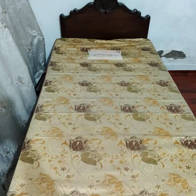 wooden bed with mattress