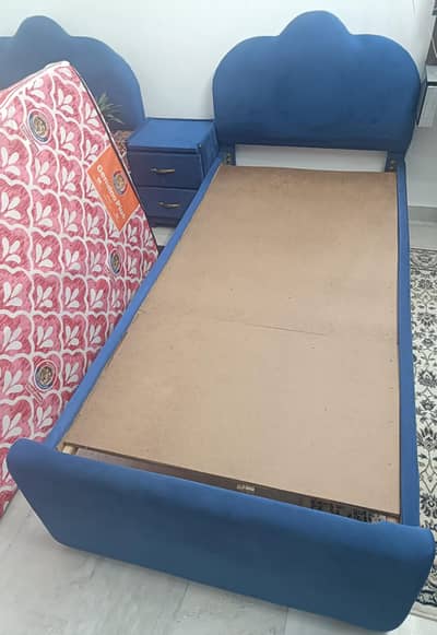 2 single bed with mattress and 1 side table