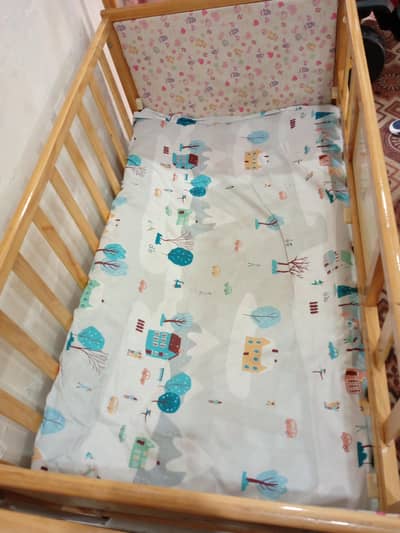 wooden baby cot with storage drawers-good condition