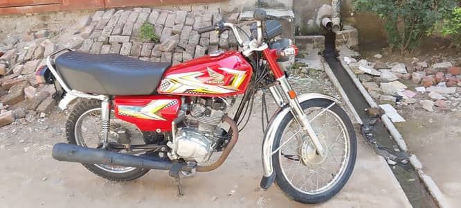 Red coloure Honda for sale