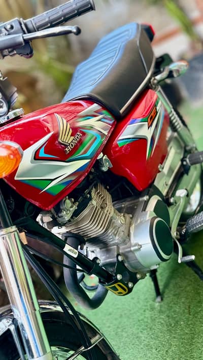 Honda CG 125 , 2023 model, Islamabad number, Red zero condition