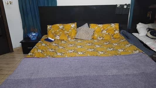 low bed with two side tables