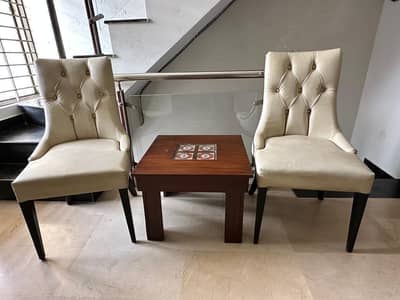 Pair of Leather Chairs with coffee table