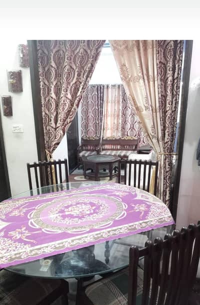 four seater dining table with four designing chairs