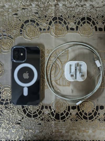 iPhone 12 with charger