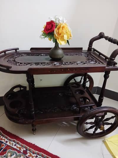 tea trolley, sheesham wood ,absolutely fine no damage, good condition
