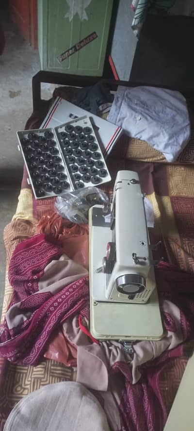 Origional American sewing machine . . 52 designs . .