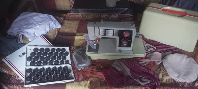 Origional American sewing machine . . 52 designs . .