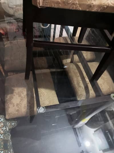 Almost new dining table with four chairs