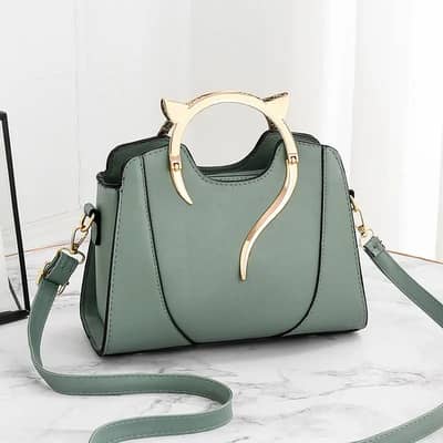 Green gold ladies hand bags in multiple colors.