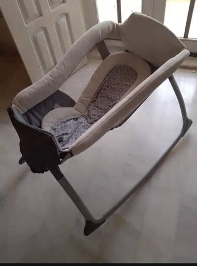 baby cot and car seat