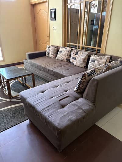 L shaped sofa with 2 tables