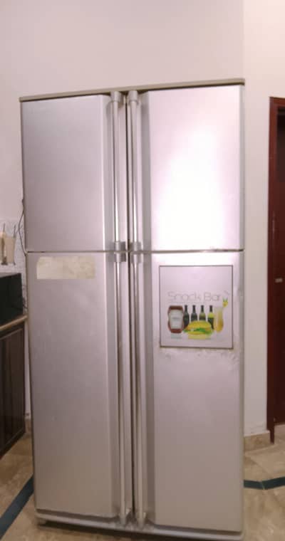 4 door Dawlance fridge 9 years old without warrenty