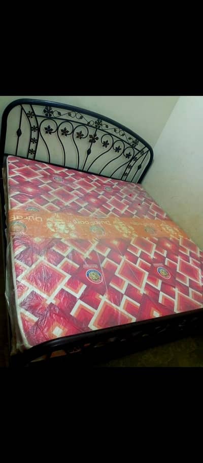 iron double bed with almost new mattress