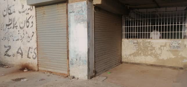 Corner Shop With Attached Bath Extra Land Lease 200 Feet Road Facing Vip Location North Karachi Sector 11A near power house chowrangi
