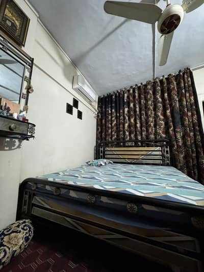 bed and dressing mirror