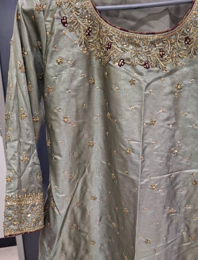 GREEN COLORED GHARARA WITH RED DUPATTA (WORN ONCE)