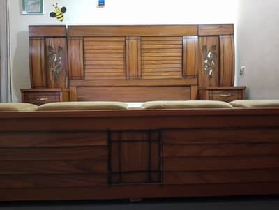 king size bed along side tables and capacity storage