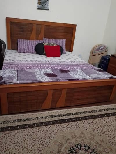 double bed with complementary dressing table