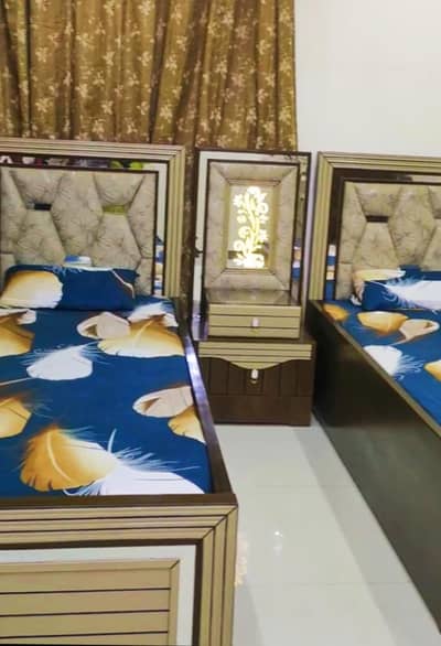 . .  2 Single bed with center table. .