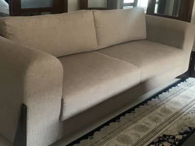 MH homes new L-style sofa with wooden legs