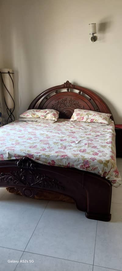Pure sheesham wood bed set with dressing table and side tables.