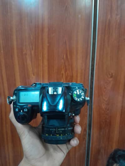 nikon d7000 with 50 mm lense all ok camera profashnal camea