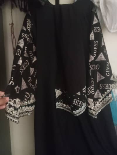 black and golden colour abaya