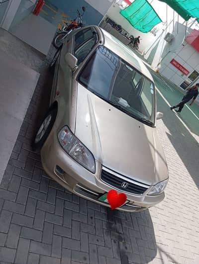 engine bilkul fit hai body haki tach hai  petrol or LPG py dono chlo h