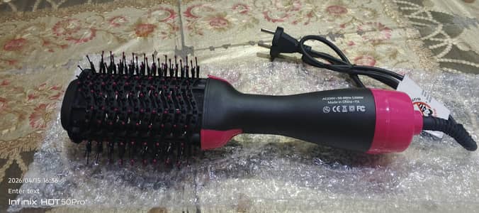 “Electric hot air styling brush for drying and styling hair”