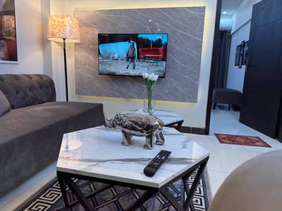 Luxury 1 bed apartment for daily stay with AC WiFi and comfortable setup ideal for families and couples